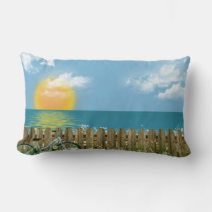 blue bicycle with sunset reflection over water lumbar pillow