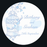 Blue birds open cage wedding sticker<br><div class="desc">Cute bird couple in graphic drawing of open bird cage hanging from a blossoming spring tree with hearts. Fashionable modern chic wedding design part of the the bird cage romantic wedding stationary set. Pretty pastel shades of blue, aqua and white. Edit this sticker with your own name and dates. Unique...</div>