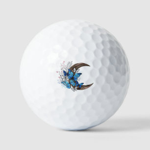 Blue butterflies on wooden crescent golf balls