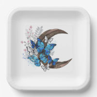 Blue butterflies on wooden crescent
