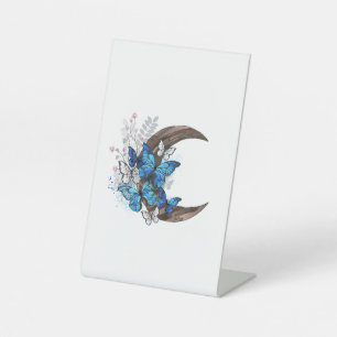 Blue butterflies on wooden crescent pedestal sign