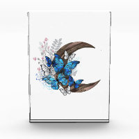 Blue butterflies on wooden crescent