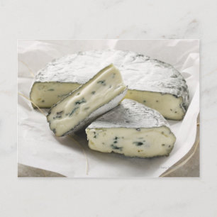 Blue cheese with pieces cut on paper postcard