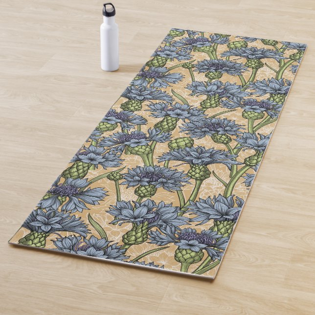 Blue cornflowers, wild flowers on honney yellow yoga mat (In Situ)