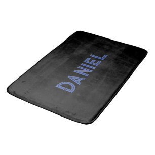 Blue custom name on black bath mat