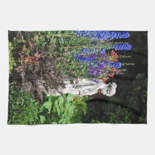 Blue delphinium flower garden and statue kitchen towel