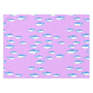 Blue fish on lilac tablecloth