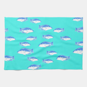 Blue fish on turquoise kitchen towel