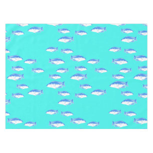 Blue fish on turquoise tablecloth