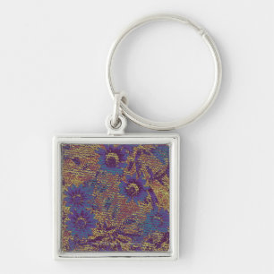 Blue flowers against leaf camouflage pattern keychain