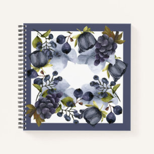 Blue flowers and fruits in frame notebook