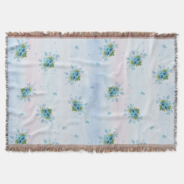 Blue forget-me-not's on a soft pink-blue throw blanket (Front)