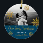 Blue Gold Snowflakes First Christmas Engaged Ceramic Ornament<br><div class="desc">Bright Christmas holiday photo ornament with gold snowflakes and navy blue background for engaged couple. Personalize it by adding your names. It's a good gift for newly weds or for a fiance/fiiancee.</div>