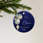 Blue gold white baubles Christmas Ceramic Ornament<br><div class="desc">A blue uneven coloured background. Decorated with white and gold baubles and some greenery and a pine cone.  Personalize and add your name,  year.  Text: Merry Christmas</div>