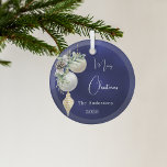 Blue gold white baubles Christmas Glass Ornament<br><div class="desc">A blue uneven coloured background. Decorated with white and gold baubles and some greenery and a pine cone.  Personalize and add your name,  year.  Text: Merry Christmas</div>