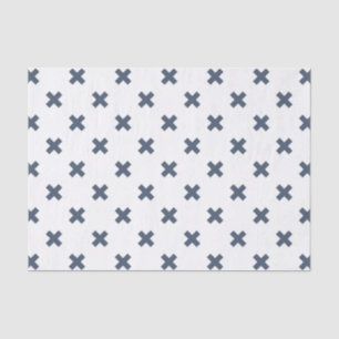 Blue-gray cross stitches on white tissue paper