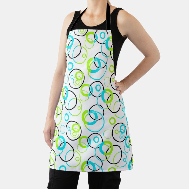 blue green and black rings and circles on white  apron (Insitu)
