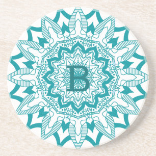 Blue-green on white mandala monogram coaster