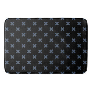 Blue-grey cross stitches on black bath mat