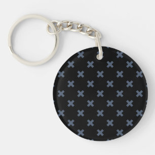 Blue-grey cross stitches on black keychain