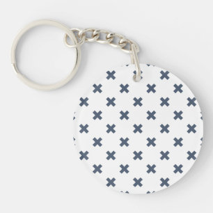 Blue-grey cross stitches on white keychain