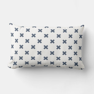 Blue-grey cross stitches on white lumbar pillow