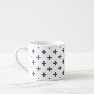 Blue-grey polka crosses on white espresso cup