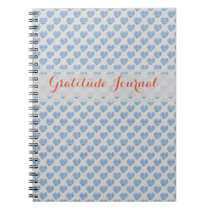 Blue hearts on grey notebook