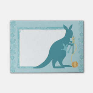 Blue kangaroo knitting needles ball of yarn post-it notes