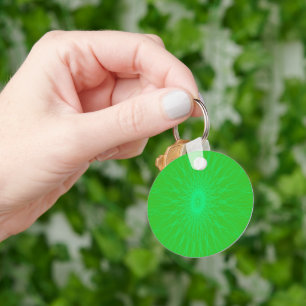 Blue mandala rays on green keychain