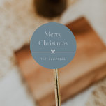 Blue | Modern Bow Simple Minimal Christmas Classic Round Sticker<br><div class="desc">Finish your holiday mailings and gifts with these sweet and simple Christmas stickers,  customizable with your preferred holiday greeting and family signature (shown with "Merry Christmas") on a soft blue background. A petite bow running through the centre completes this elegant minimalist holiday design.</div>