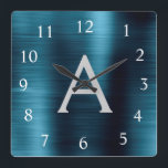 Blue Modern Elegant Metallic Monogram Name Square Wall Clock<br><div class="desc">Modern and Elegant Blue Faux Stainless Steel Foil Monogram Name and Initial Personalized Custom Wall Clock. The Wall Clock makes the perfect gift for someone who loves trendy chic metallic decor to give as a Christmas or Birthday Gift.</div>