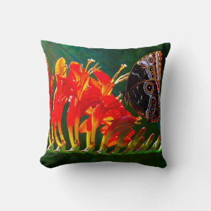 Blue morpho butterfly on Crocosmia Lucifer flowers Throw Pillow