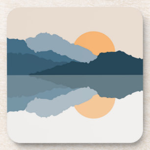 Blue mountains reflected in the lake coaster
