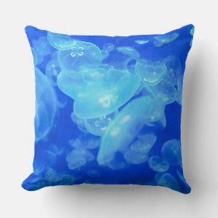 Blue ocean white jellyfish throw pillow