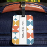 Blue orange yellow mid century modern monogram luggage tag<br><div class="desc">Make your luggage stand out with our retro-inspired luggage tag featuring a vibrant seventies or sixties vintage pattern. The tag showcases a captivating design with half circle and scallop shapes in eye-catching shades of blue, orange, and yellow. Whether you're a frequent traveller, a retro enthusiast, or simply someone who appreciates...</div>