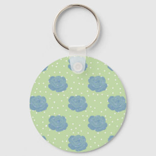 Blue rose pattern on green backround keychain