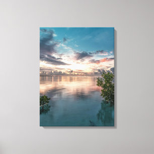 blue sky with red and dark clouds reflected on sea canvas print