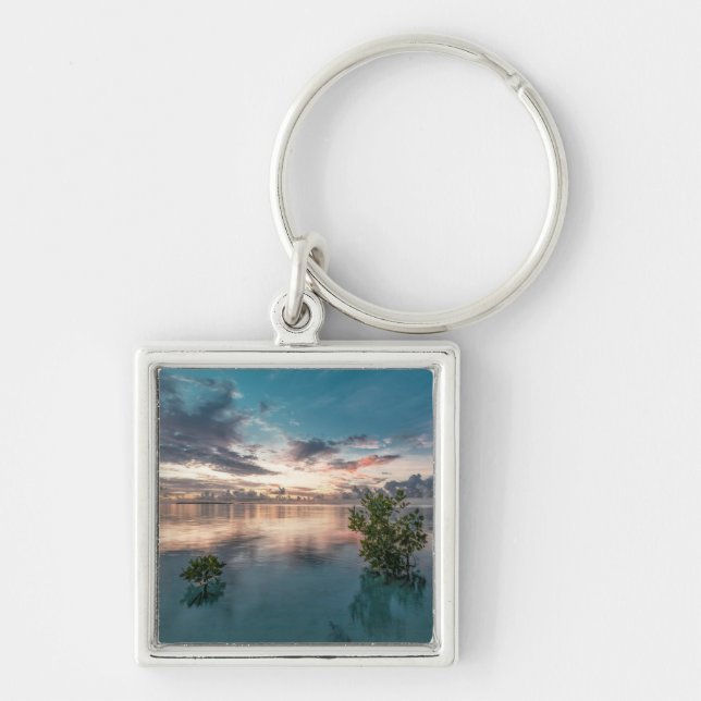 blue sky with red and dark clouds reflected on sea keychain (Front)