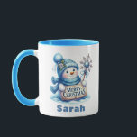 Blue Snowman Merry Christmas Sign Mug<br><div class="desc">Spread holiday cheer with this Personalized Blue Snowman Merry Christmas Sign Mug! This charming Christmas coffee mug features an adorable snowman dressed in a cozy blue hat and scarf, holding a festive 'Merry Christmas' sign and a sparkling snowflake wand. Easily customize it with any name to make it a perfect...</div>
