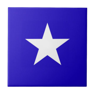 Blue star on white background tile
