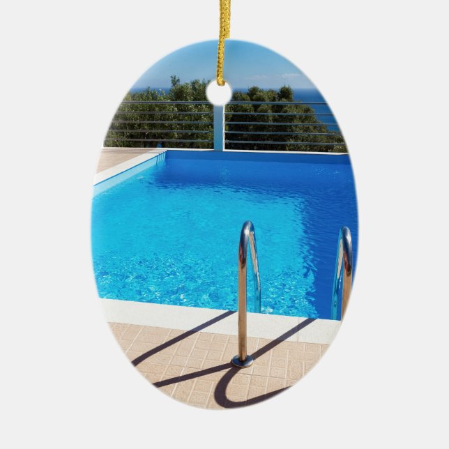 Blue swimming pool with steps at sea ceramic ornament (Front)