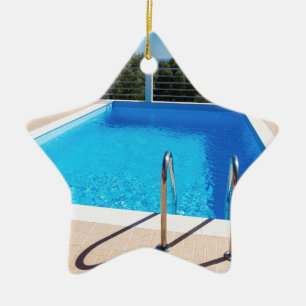 Blue swimming pool with steps at sea ceramic ornament