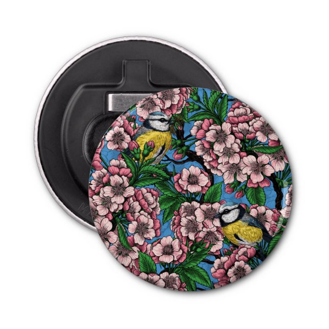 Blue tit birds in the blooming cherry tree on blue bottle opener (Front)