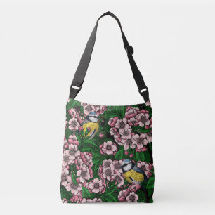 Blue tit birds in the blooming cherry tree on gree crossbody bag
