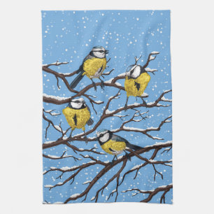 Blue tit birds in winter kitchen towel