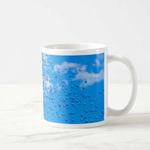 Blue toy balloons in the sky coffee mug