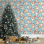 Blue Vintage Santa Claus Christmas Wallpaper<br><div class="desc">Bring the magic of the holidays into your home with this blue vintage Santa Claus Christmas wallpaper. Featuring charming illustrations of Santa's cheerful face and delicate snowflakes against a blue background, this design adds a festive and nostalgic touch to any room. Perfect for creating a cozy and merry atmosphere, this...</div>