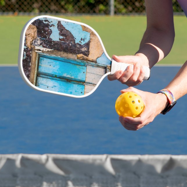 Blue wall and door pickleball paddle (Insitu)
