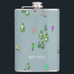Blue Winter Skiers Skiing pattern  Hip Flask<br><div class="desc">Ski opening! Cool winter-themed skier pattern design with skiers skiing down alpine ski resort slopes among snow-covered fir trees in the alps. Freeride skiers are wearing colourful vintage retro ski suits, skiing downhill with skis on a pastel pink snowy mountain landscape background. Wonderful winter sports fun gift for a skier...</div>